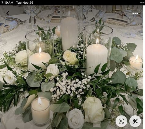 White Flowers And Greenery Centerpieces, January Wedding Centerpieces Simple, White And Green Wedding Centerpieces Candles, Eucalyptus Centerpiece Round Table, Wedding Centerpieces White Flowers, Wreath Centerpiece Wedding, Eucalyptus Wedding Table Decor, Green And White Centerpieces, Budget Friendly Wedding Centerpieces