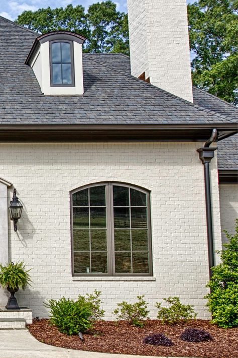 Elegant arched wooden Sierra Pacific windows in a residential setting in Tuscaloosa, Alabama showcasing the natural beauty of wood frames. Pella Iron Ore Windows, Pella Windows Fossil Color, Sierra Pacific Windows, Brown Interior Paint, Houses Exterior, Lake Houses Exterior, Pella Windows, Lake Houses, Exterior Paint Color