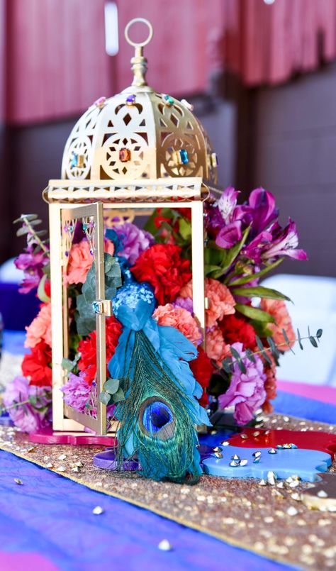 Colorful Fresh Floral Centerpiece Created by @lechicboutique_1 for a Moroccan inspired 70th Birthday Soirée. #lechicboutique_1 #lechicboutique909 70th Birthday Balloons, Aladdin Wedding Theme, Indian Wedding Centerpieces, Arabian Nights Prom, Moroccan Theme Party, Aladdin Wedding, Arabian Party, Arabian Theme, Aladdin Birthday Party