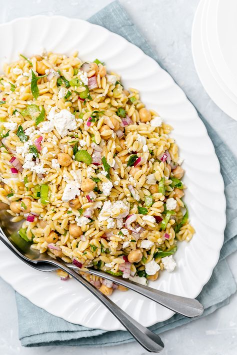 This delicious vegetarian orzo salad with feta and chickpeas makes the best side dish or main meal! Tossed in lemon vinaigrette, it's easy to make ahead! Lemon Honey Orzo Salad, Lemon Feta Orzo, Orzo Salad Recipes Cold Feta, Orzo Salad With Zucchini And Feta, Lemon Orzo Chickpea Salad, Salad Appetizer Cups, Orzo Salad Recipes, Orzo Recipes, Mint Salad