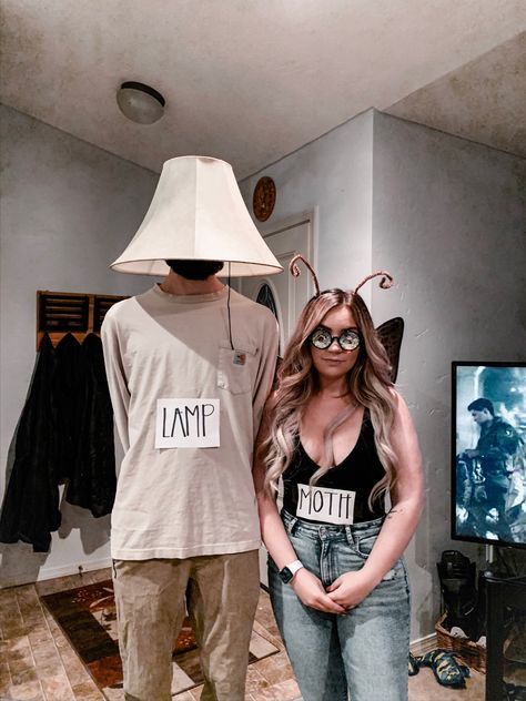 Couple wearing moth + lamp costumes Meme Couple Costume, Moth And Flame Costume, Moth And Lamp Halloween Costume, Halloween Costumes Couples Funny Unique, Lamp And Moth Costume, Butterfly Couple Costume, Moth Costume Women, Unique Cosplay Ideas, Moth And Lamp Costume