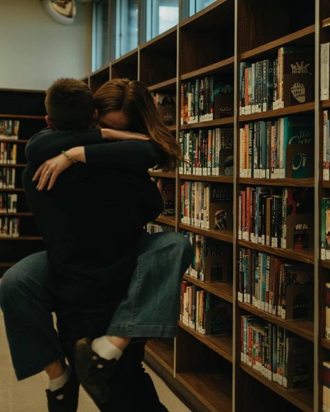 In the cozy corners of the public library, Elizabeth and Drake’s love stood out among the rest. 🤎 These public library sessions definitely pushed me out of my comfort zone…having to work with indoor lighting and absolute no natural light was a challenge, among with the small spaces, and other people around…I am obsessed with the results. I couldn’t be more grateful for the two couples who gave it a shot! It truly was a treat getting to know and capture the love that they have for each other.... Library Date Couple, Couple Reading In Bed, Couples In Library, Couple In A Library, Library Couple Photoshoot, Couples Studying Together, Couple In Bookstore, Library Couple, Engagement Photos In Bookstore