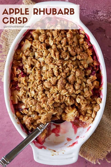 One bite of this Easy Apple Rhubarb Crisp and you won't ever make another crisp recipe again. This irresistible combination of sweet apples and tart rhubarb with a crunchy streusel topping always disappears. Apple Rhubarb Recipes, Rhubarb Apple Crisp, Rhubarb And Apple Crumble, Apple Rhubarb, Berry Crisp, Sweet Apples, Rhubarb Desserts, Rhubarb Crisp, Rhubarb Crumble