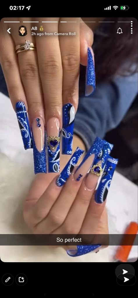 Blue Bandana Nails Acrylic, White And Blue Long Nails, Long Blue Baddie Nails, Blue Nails Dramatic, Blue Paisley Nails, Blue Curved Nails, Blue Long Nails Acrylic, Crip Blue Nails Acrylic, Royal Blue Tattoo