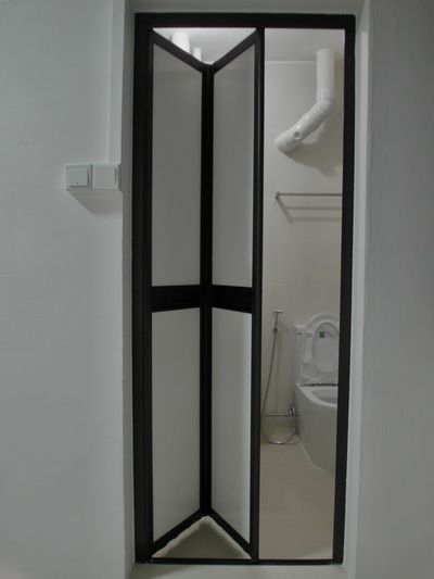 Bi-Fold Doors - DOCTOR DOORS DECOR PTE LTD Small Toilet Door Ideas, Folding Doors For Bathroom, Concertina Doors Bathroom, Bi Folding Bathroom Door, Toilet Bifold Door, Folding Door Bathroom, Foldable Shower Door, Shower Accordian Door, Bathroom Folding Door