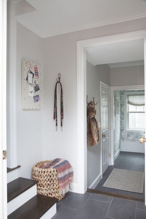 Beautiful foyer features walls painted light gray, Benjamin Moore Balboa Mist, lined with Anthropologie Equestrian Hook over Basaltina Porcelain Tiled floor. Purple Gray Bedroom, Benjamin Moore Paint Colors Gray, Benjamin Moore Balboa Mist, Kylie M Interiors, Taupe Paint Colors, Best Gray Paint, Best Gray Paint Color, Master Suite Addition, Balboa Mist