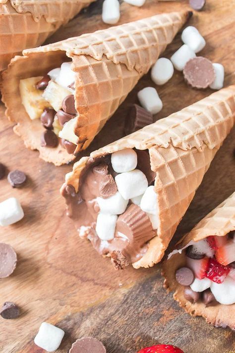 These Waffle Cone Smores are a fun treat any time of year. A summer twist on a fall treat or a fall twist on a summer treat – You decide! These Waffle Cone Smores are a delicious treat whichever way you cook them, but let's be honest - it's most fun to cook on the grill! Waffle Cone Smores, Cone Smores, Waffle Cone, Waffle Cones, Fall Treats, Fun Treats, Treat You, On The Grill, Cooking On The Grill