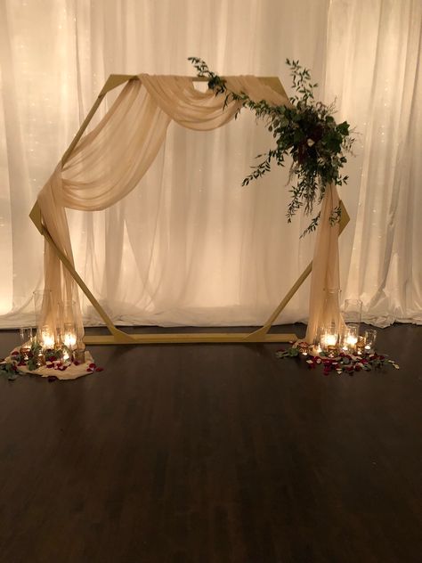 Wedding Arch Ideas Diy Indoor, Altar Ideas Wedding Indoor, Arbor With Draping, Diy Wedding Arch Drapery, Hexagon Background Wedding, How To Drape A Wedding Arch, Champagne Wedding Arch, Wedding Arch With Backdrop, Drapes For Wedding Ceremony