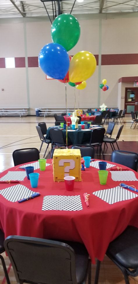 Super Mario Table Centerpieces, Mario Birthday Party Table Decorations, Super Mario Table Decorations, Super Mario Bros Centerpiece Ideas, Video Game Baby Shower Theme, Video Game Baby Shower Ideas, Mario Kart Backdrop Ideas, Mario Kart Birthday Party Centerpieces, Mario Baby Shower Ideas