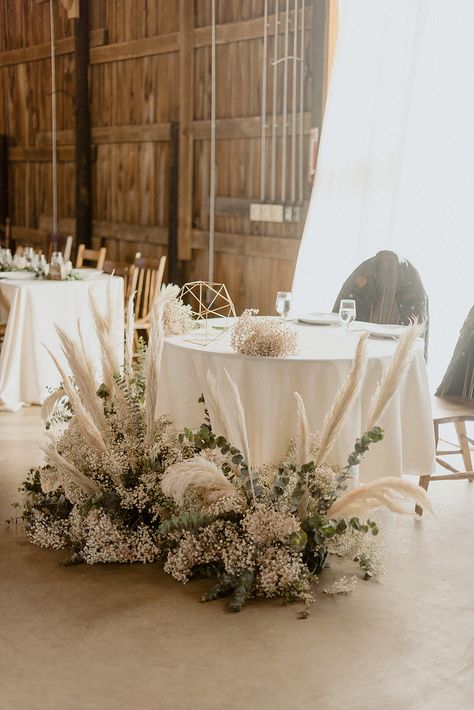 Wedding Sweetheart Table Inspiration from Pretty Little Vintage Co. | wedding table | wedding decor | wedding inspiration #weddingdecor #sweethearttable #weddinginspiration Bride And Groom Table Pampas, Boho And Greenery Wedding, Sweetheart Table Wedding Pampas, Wedding Head Table With Bridal Party, Pampas Grass Sweetheart Table, Sweetheart Table Wedding Boho, Sweetheart Table Pampas, Me And Mrs Table, Boho Head Table Wedding