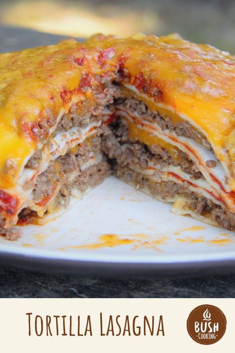 This Mexican inspired 'lasagna' uses tortillas instead of pasta along with taco seasoning for the ground beef. It is perfect for camp dinner. #bushcooking #lasagna #dutchoven #tortilla #campcooking #outdoorrecipe #homemade Mexican Lasagna With Tortillas, Tortilla Lasagna, Camp Dinner, Dutch Oven Lasagna, Dutch Oven Recipes Cast Iron, Oven Tacos, Rice Casserole Recipes, Mexican Casserole, Dutch Oven Cooking