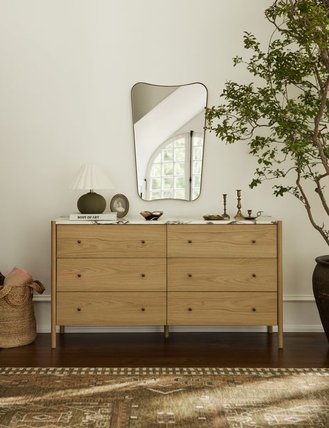 The Belvoir mirror offers sleek simplicity with its slim brass-finished frame. Its tapered shape bows at the top and bottom, styling an artful silhouette with a modern edge. Mount this wall mirror from your entryway to bath for a finishing touch that's both functional and chic. Fall Furniture, Dresser Table, Wall Bed, Outdoor Furniture Collections, Modern Dresser, Bedroom Dressers, Outdoor Dining Furniture, A Living Room, Interior Design Tips