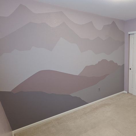 Grey purple mural of mountain range for baby girl nursery. Uses mixes of HGTV Sherwin Williams paints for Lowe's, coopersmith, smoky purple, triple berry, and Behr royal raisin Pale Purple Nursery, Baby Girl Nursery Room Ideas Purple, Baby Girl Mountain Nursery, Purple And Grey Nursery, Purple Mural, Plum Nursery, Gold Baby Room, Mountain Nursery Theme, Woodsy Nursery