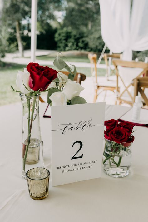 Red White Centerpieces Wedding, Romantic Dinner Centerpiece, Elegant Red Rose Centerpieces, Minimalist Red Wedding Decor, One Rose Centerpiece, Red Table Numbers Wedding, Wedding Decor With Red Roses, Burgundy And White Wedding Centerpieces, Red Rose Wedding Reception Decor