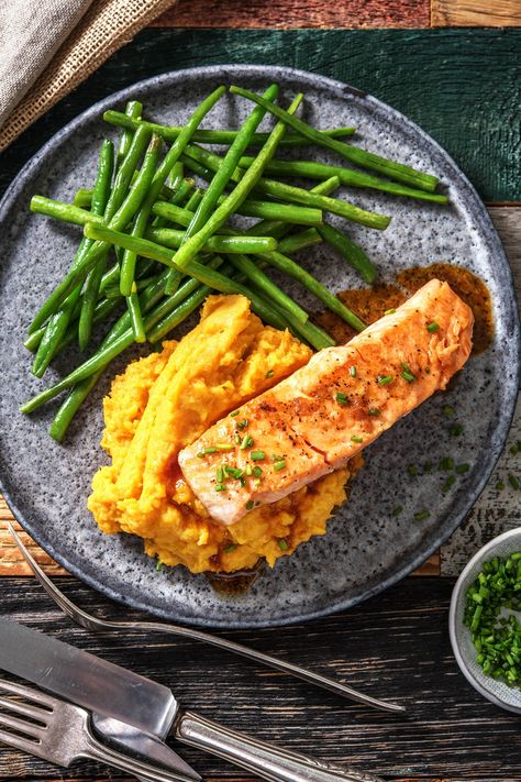 In this dish, salmon is drizzled with a sweet soy-maple glaze and pan-seared to a crispy finish. The dish is finished to perfection with chives, sweet potato mash and crispy green beans. The ideal weeknight supper! Salmon With Asparagus, Crispy Green Beans, Maple Glazed Salmon, Sweet Potato Mash, Salmon Glaze Recipes, Salmon And Sweet Potato, Honey Garlic Salmon, Hello Fresh Recipes, Garlic Salmon