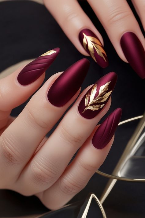 Dark Red With Gold Nails, Burgundy Autumn Nails, Burgundy Gold Nail Designs, Red Gold Nail Art, Red And Gold Almond Nails, Gold Autumn Nails, Burgundy Almond Nails Design, Wine Color Nails Designs, Red Gold Nails Design