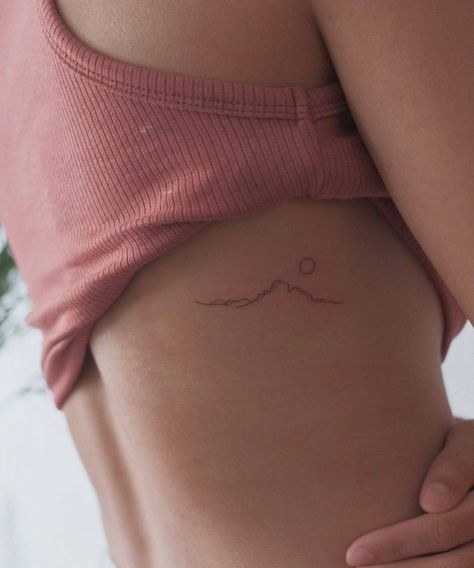 Minimalist mountain tattoo on the rib. Minimalist Mountain Tattoo, Berg Tattoo, Small Mountain Tattoo, 27 Tattoo, Mountain Tattoos, Tattoos On Side Ribs, International Tattoo, Rib Tattoos For Women, Minimalist Mountain