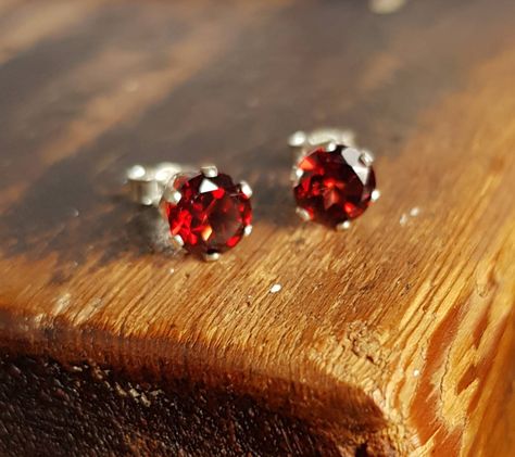 🤍GARNET EARRING These garnet stud earrings feature the stunning wine red faceted garnets. The beautiful, genuine garnets are prong set in sterling silver stud earrings. The garnets are stunning clear garnet red. Their rich deep colour combine with the silver to create very regal earrings. The garnets are genuine gemstones and faceted cut with a 6mm round diameter. The earrings settings and posts are sterling silver. The earrings are supplied with sterling silver butterfly backs as shown in the January Gifts, Garnet Earrings Silver, Red Stone Earrings, Red Earrings Stud, Red Studs, Geode Earrings, Garnet Red, Birthstone Earrings, Colour Inspiration