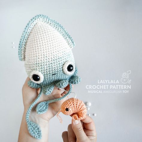 ✨NEW CROCHET PATTERN 🦑❤️🦐💦✨ Ahoy there, creative sousl! Are you ready to enter a new exciting crochet project? Let’s dive deeeeeep down into the sea of creativity to make friends with lovely baby squid Seamus! Guess what – Seamus is not just another adorable amigurumi but a #musicaltoy 🎶 featuring a melody that will put even the grumpiest crab in a good mood. Have you spotted Seamus‘ cute shrimp friend Shelly yet? Pull on the little shrimp and the music box mechanism in Seamus‘ body will ... Cute Shrimp, Ocean Crochet, Octopus Crochet, Amigurumi Knitting, Pattern Printable, Crochet Octopus, Creative Soul, Amigurumi Tutorial, Crochet Diy