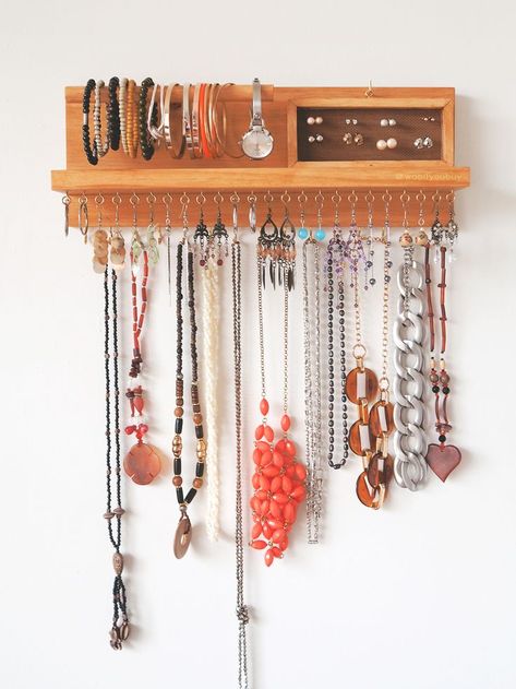 This is a wooden wall mounted jewellery organiser that is specifically made to declutter all your jewellery. No more tangled necklaces, mismatched earrings or lost bracelets! Have everything on display for us, ladies that are on the go!  Earrings holder - Bracelet holder - Jewellery holder - Necklace organiser - jewellery storage - jewelry holder - jewelry organizer - Necklace hanger - Wall mount jewelry holder - Necklace display Earrings Holder, Jewellery Organiser, Boho Jewelry Diy, Vintage Jewelry Diy, Diy Jewelry To Sell, Necklace Hanger, Wall Mount Jewelry Organizer, Bracelet Holder, Bracelet Holders