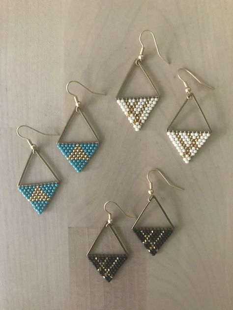 Mini dangle earrings with a geometric design. Available in ivory, black, or turquoise. Japanese glass beads, brass frame, gold plated hooks. Hand beaded with love in Northern California. Beaded Earrings Diy, Jewerly Beads, Brick Stitch Earrings, Beaded Jewelry Designs, Beaded Earrings Patterns, Triangle Earrings, Earring Patterns, Seed Bead Earrings, Bijoux Diy