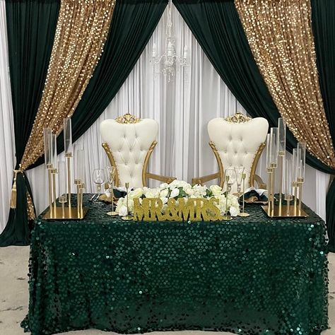 Emerald Green And Gold Centerpieces Wedding, Emerald Green Bride And Groom Table, Emerald And Gold Backdrop, Emerald Green And Gold Reception Decor, Emerald Green And Gold Main Table, Hunter Green Gold Wedding, Green And Gold Reception Decor, Quince Backdrop Ideas Emerald Green, Green Black Gold Wedding Theme