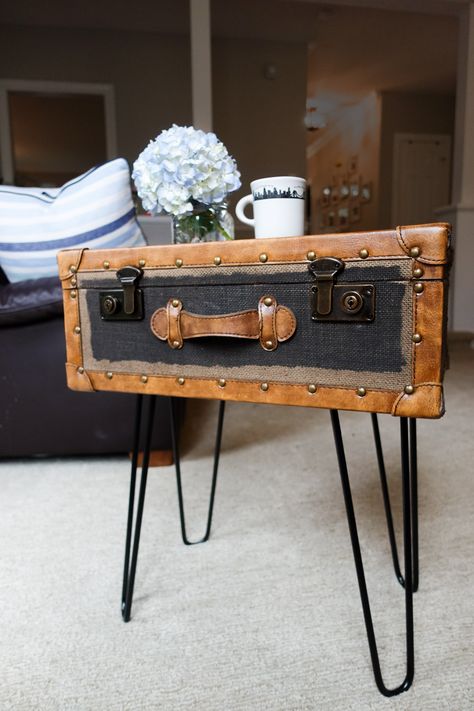 How To Make A Side Table From A Vintage Suitcase We found a vintage suitcase a few weeks ago at a thrift store and it was the perfect size for a side table or nightstand.  We found some affordable metal hairpin table legs on Amazon and attached them to the suitcase to create a super easy side table or nightstand. Suitcase Table Diy, Diy Vintage Suitcase, Vintage Suitcase Decor, Suitcase Furniture, Table Legs Diy, Vintage Suitcase Table, Hairpin Table Legs, Suitcase Table, Suitcase Decor