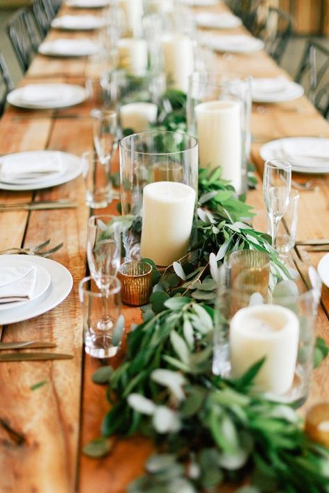 Rustic farm table with candles and greens draped down the table Wedding Table Garland, Wedding Candles Table, Long Table Wedding, Greenery Wedding Decor, Table Garland, Table Arrangements Wedding, Wedding Table Designs, Rustic Wedding Table, Wedding Floral Centerpieces