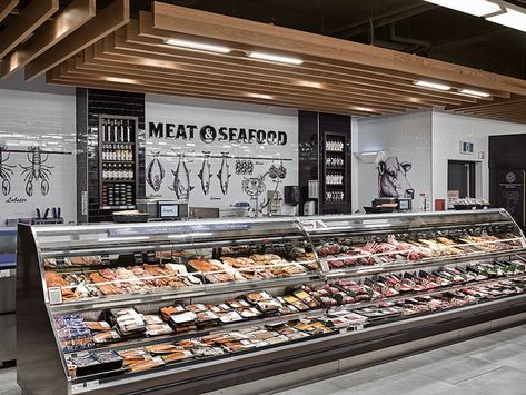 Meat & Seafood - Original hand drawn illustrations applied to the walls at meat & the Meat & Seafood department creates the old school european butcher shop at this service point and plays homage to the "the market" type shopping experience of the past while the colour palette and suspended trellis brings an urban feel to this service point. Meat Display, Meat Store, Seafood Shop, Grocery Store Design, Food Retail, Retail Marketing, Meat Shop, Supermarket Design, Seafood Market