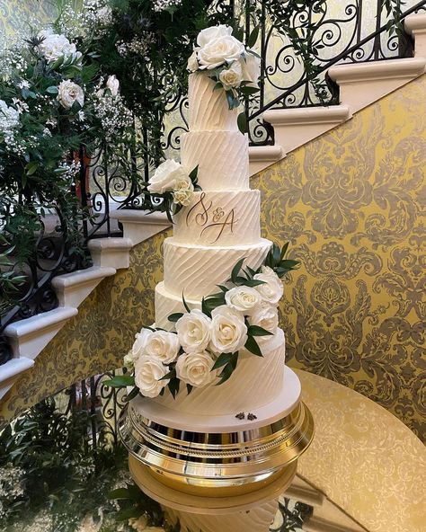 Showstopper of a 6 tier buttercream frosted wedding cake with diagona texture to echo the diagonal arrangement of fresh flowers. Personalised acrylic monogram provided by the couple. 6 Tier Wedding Cake, Frosted Wedding Cake, 6 Tier Wedding Cakes, Winter Reception, Art Deco Wedding Cake, Acrylic Monogram, Buttercream Wedding Cake, Fashion Cakes, Tiered Wedding Cake