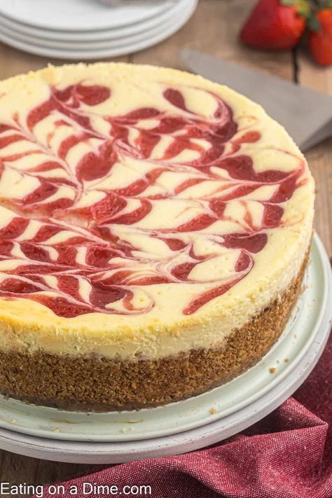 Strawberry Swirl Cheesecake - Eating on a Dime Strawberry Swirl Cheesecake, Quick Bread Recipes Easy, Strawberry Cheesecake Recipe, Eating On A Dime, Frozen Cheesecake, Swirl Cheesecake, Pizza Recipes Easy, Classic Cheesecake, Easy Cheesecake Recipes