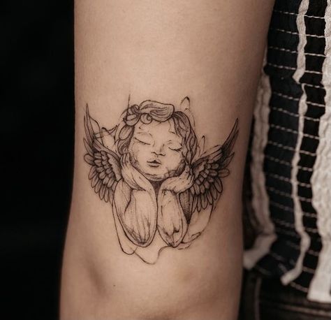 Angels With Flowers Tattoo, Her Angel Eyes Saw The Good Tattoo, Angel Above Knee Tattoo, Realistic Cherub Tattoo, Cherub Rib Tattoo, Angel Tattoo On Thigh, Cherub Angel Tattoo Simple, Angel Tattoo Leg, Fine Line Angel Tattoo