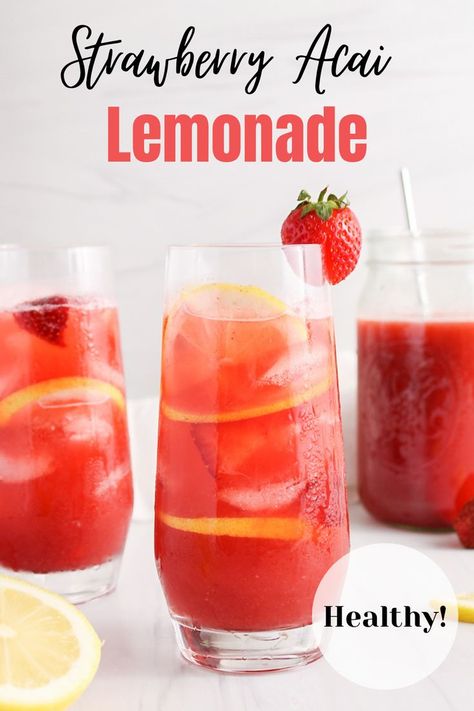 Front view on a tall glass filled with a strawberry acai lemonade refresher with ice cubes, fresh strawberries and lemon slices. There are more of the lemonade in a large pitcher in the background and a second glass on the side as well. There are halved lemon beside the glasses too. Starbucks Strawberry Açaí Lemonade, Starbucks Strawberry Acai Refresher With Lemonade Recipe, Starbucks Strawberry Acai Lemonade, Lemonade Refresher Starbucks, Strawberry Acai Lemonade Refresher, Strawberry Refresher Recipe, Strawberry Acai Lemonade, Strawberry Açaí Lemonade, Acai Lemonade