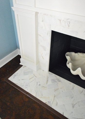 Herringbone marble subway on hearth, running bond set on face. Fireplace Makeover Marble, Fireplace Redo, Maria Killam, Fireplace Update, Tile Fireplace, Fireplace Tile Surround, Victorian Fireplace, Young House, White Fireplace