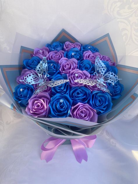 Beautiful handmade satin rose bouquet. Great for anniversaries, birthdays, holidays, weddings, graduations or simply to show someone you're thinking of them. Dimensions are included in the pictures, but depend on the number of roses selected. The pictured bouquet has 25 roses for reference. Please message us with questions or custom requests. Purple And Blue Flower Bouquet, Flower Arrangement Birthday, Banquet Flower, Satin Rose Bouquet, Satin Ribbon Bouquet, Bouquet Mothers Day, Satin Bouquet, Forever Flower Bouquets, Ribbon Rose Bouquets