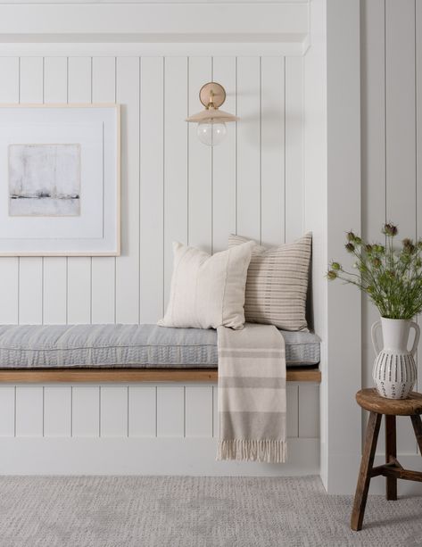 Relaxed Coastal Interior, Beach Cottage Interiors Coastal Style, Vertical Shiplap Over Fireplace, Shiplap Nook Wall, Shiplap Wall Coastal, Beachy Hallway, Coastal Farmhouse Mudroom, Coastal Minimalist Living Room, Shiplap Entryway With Bench