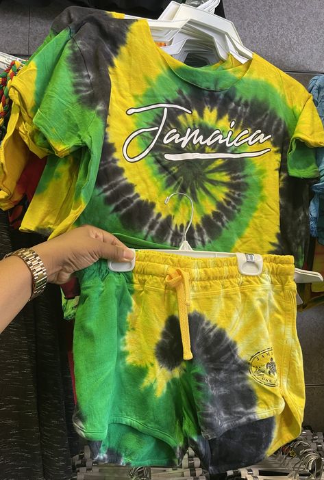 "Jamaica tie-dye shorts set with Jamaican colors green, gold and black.  It is a crop top and shorts set with Jamaica printed on the top. Material- Cotton  Made In Jamaica. Shipping policies Estimated Delivery Date for\" Standard Shipment\" a) Shipping to the US, Canada takes about 14-30 days. b) Shipping to other countries takes about 1-2 months. Please note that shipping time vary from different area, even though in the same country, maybe others may receive packages earlier, others may receiv Jamaican Streetwear, Jamaica Shorts, Jamaica Shirt Ideas, Tropical Multicolor Vacation T-shirt, Jamaica Colors, Jamaican Colors, Jamaica Shirt, Vintage Football Shirts, Tie Dye Crop Top