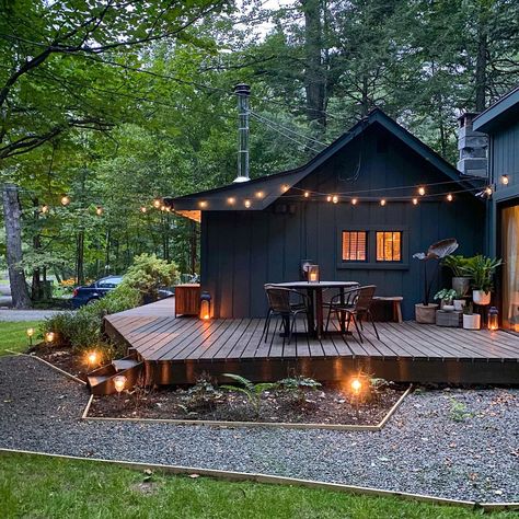 26 Cabin Exterior Ideas: Modern, Rustic, and Charming Designs for Every Setting - placeideal.com Rustic Modern Log Cabin, Small Modern Log Cabin, Cabin Deck Ideas, Rap Around Porch, Cabin Exterior Ideas, Cabin Landscaping, Rustic Cabin In The Woods, Rustic Modern Cabin, Cabin Patio