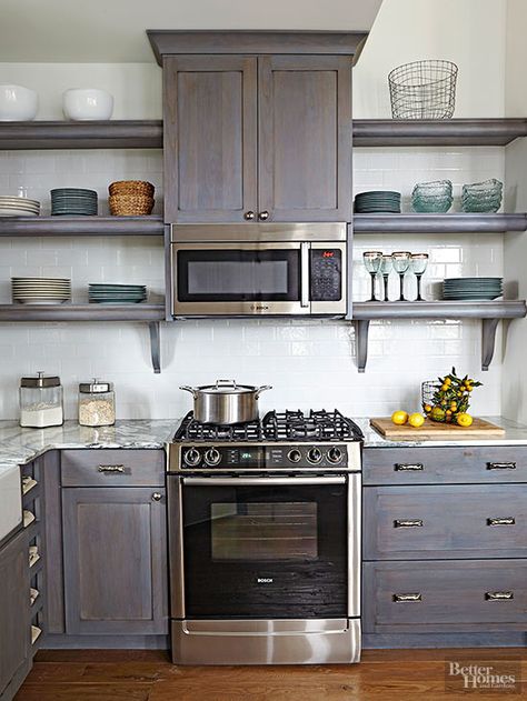 Open shelves eliminate the heavy look of closed cabinetry and lighten up small spaces. Closed base cabinets provide storage for utilitarian, not-so-display-worthy pieces while keeping the visual bulk below eye level. Placing the microwave above the range frees valuable counter space for cooking while keeping it out of kids' reach. Ad Kitchen, Cabinets And Shelves, Microwave Cabinet, Cabinet Shelves, Small Kitchen Storage, Microwave In Kitchen, Cabin Kitchens, Kitchen Redo, Open Shelves