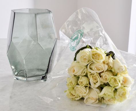 items you need to arrange roses in a glass vase Arranging Roses In A Vase, How To Arrange Roses In A Vase, Roses Arrangements Vase, Small Rose Vase Arrangements, Roses In Square Vase, Glass Vase With Single Rose, Pink Roses Round Vase, Rose In A Glass, Rose Floral Arrangements