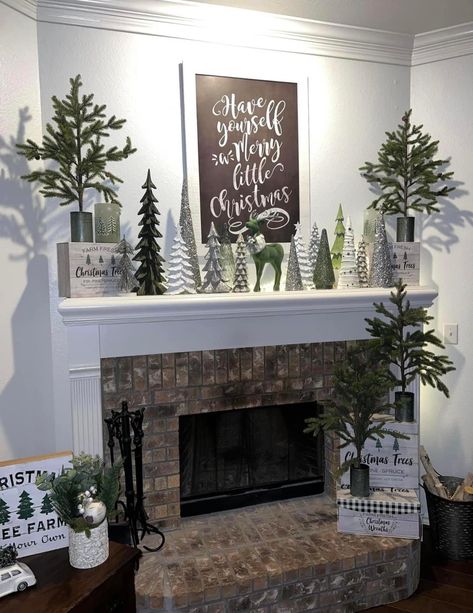 Christmas Fireplace With Deer, Christmas Mantels With Trees, Christmas Trees On Mantle, Christmas Mantel Decorating Ideas Rustic, Fireplace Wall With Tv, Christmas Fireplace Mantle Decorations, Living Room Stone Fireplace, Fireplace Tv Wall Decor, Black Christmas Decorations