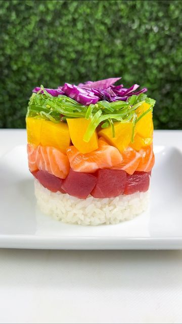 WΛVE 波 Asian Bistro & Sushi on Instagram: "RAINBOW SUSHI STACK 🌈🙌🏼 Taste the freshness with this beautiful creation! Piled high with fresh tuna, salmon, mango, seaweed salad, red cabbage and sushi rice 👌🏼 Add the sauce of your choice for an extra burst of flavor 😍 Which sauce are you adding?!" Sushi Stack, Rainbow Sushi, Salmon Mango, Sushi Salmon, Asian Bistro, Sushi Menu, Sushi Sushi, Fresh Tuna, Sushi Rice