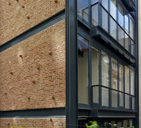 Image 7 of 17 from gallery of NoXX Apartment / CM Architecture. Photograph by Cemal Emden Industrial Facade, Steel Architecture, Brick Architecture, Apartment Architecture, Exposed Brick Walls, Brick Facade, Design Exterior, Building Facade, Brick Building