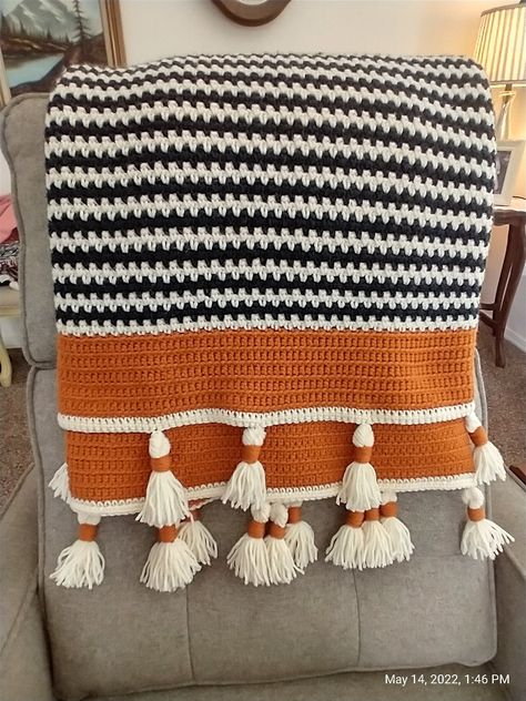 Rust Crochet Blanket, Earthy Crochet Blanket, Western Crochet Ideas, Orange Yarn Crochet Projects, Crochet Blanket Tassels, Crochet Boho Blanket, Fall Blanket Crochet, Crochet Fall Blanket, Fall Crochet Blanket