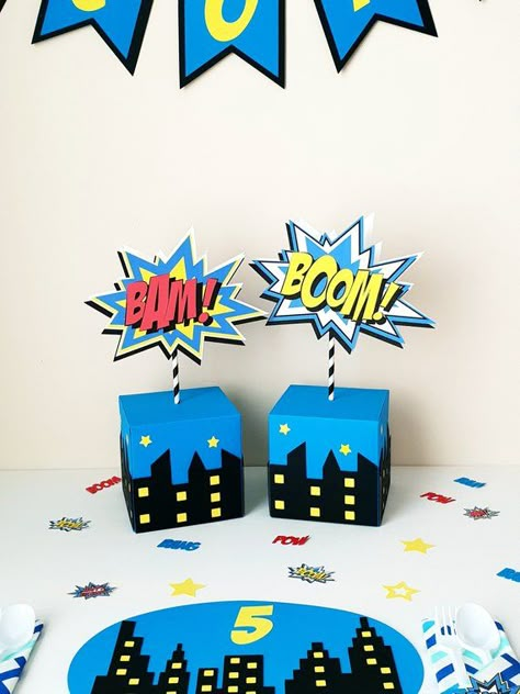 Superhero/Comic Book Table Decoration and Comic Book Sign. Adding those extra touches to your little ones party tables will WOW your guests and will be great to keep after the party celebrations are complete. All handmade using quality card stock. Comes already assembled, simply place Avenger Party, Superhero Comic Book, Godzilla Birthday, Superman Party, Marvel Birthday Party, Pj Masks Birthday Party, Superman Birthday, Spiderman Birthday Party, Avengers Party