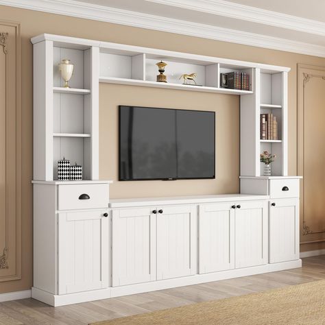 PRICES MAY VARY. [All in One TV Stand]: The modern TV cabinet wall unit is suitable for TVs up to 75 inches and comes with 4 sections. Integrate a TV cabinet, bookshelf, and wine cabinet into one to create a personalized storage living room. [Large Storage Space]: This wall unit TV cabinet features a stylish shape and color scheme that perfectly blends into any room style. There are 9 open shelves, 2 drawers and 4 cabinets with adjustable shelves to easily store audio and video equipment. [High Small Entertainment Center Ideas, Entertainment Center Decor Living Room, Tv Storage Ideas, Model Homes Interiors Photo Galleries, Living Room Designs Tv Wall, Ikea Tv Wall Unit Ideas, Cabinet Under Tv, Tv Stand With Bookshelves, Wall Unit Ideas Living Room