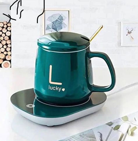 🛍️🛒Cup Warmer Set/Mug And Heater Gift Set. Tired of drinking cold coffee and tea? All you need is this portable mug heater! 💗Light enough to have it everywhere, at home or in the office. 💗You can keep your coffee or tea warm simply by placing it on the special surface. 💗With on/off button and choice of two temperature settings. 💗Ideal for keeping the baby’s bottle warm during the night! Just plug it in and forget all about cold tea or cold drink! It works well with AC. 🏷️Price:N10,000. ... Coffee Mug Warmer, Self Heating Mug, Travel Tea Mug, Tea Travel Mugs, Bottle Warmer, Cold Coffee, Cold Drinks, All You Need Is, Coffee Tea