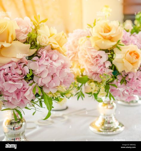 Download this stock image: Still life with a wedding bouquet of flowers. Pink hydrangeas and yellow rose on table. Close up - MB5AGJ from Alamy's library of millions of high resolution stock photos, illustrations and vectors. Light Pink And Yellow Wedding Flowers, Yellow And Pink Themed Party, Pink And Yellow Roses Arrangement, Pastel Pink And Yellow Wedding Theme, Light Pink And Yellow Wedding, Pink Yellow Flower Arrangement, Pink And Yellow Wedding Theme, Yellow Pink Wedding, Yellow And Pink Wedding