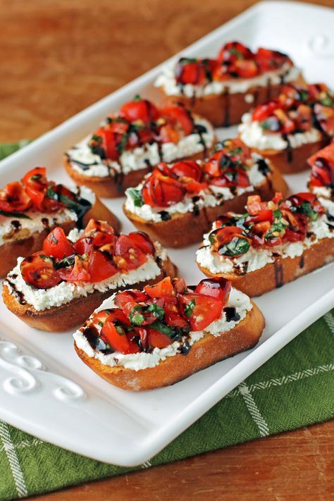 Tomato and Goat Cheese Bruschetta - Emily Bites Cheesy Bruschetta Bites, Appetizer Recipes Bread, Tiny Bites Appetizers, Birthday Snacks Healthy, Small Orderves Party Appetizers, Pasta Bites Appetizers, Christmas Bruchetta, Christmas Bruchetta Appetizers, Cup Food Ideas Parties