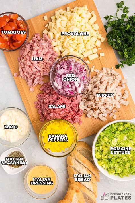 This easy Hoagie Dip takes everything you love about an authentic Italian hoagie and turns it into delicious dip form. All the deli meat and cheeses chopped and tossed with a creamy Italian dressing and scooped up with crusty baguette slices. Skip the sub shop and make this at home for a new favorite! | www.persnicketyplates.com Deli Meat Recipes Healthy, Deli Meat Meal Prep, Hoagie Chopped Salad, Easy Hoagie Sandwiches, Italian Chop Sandwich, Chopped Italian Sandwich Wrap, Chopped Sandwich Salad, Chopped Hoagie Salad, Chopped Sub Sandwich Salad